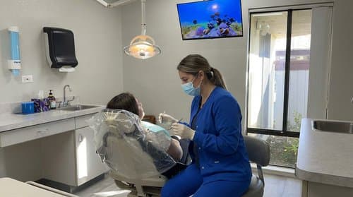 Dr. Katireddy providing gentle dental care in the treatment room
